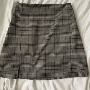 Blue/white/grey/black plaid skirt.